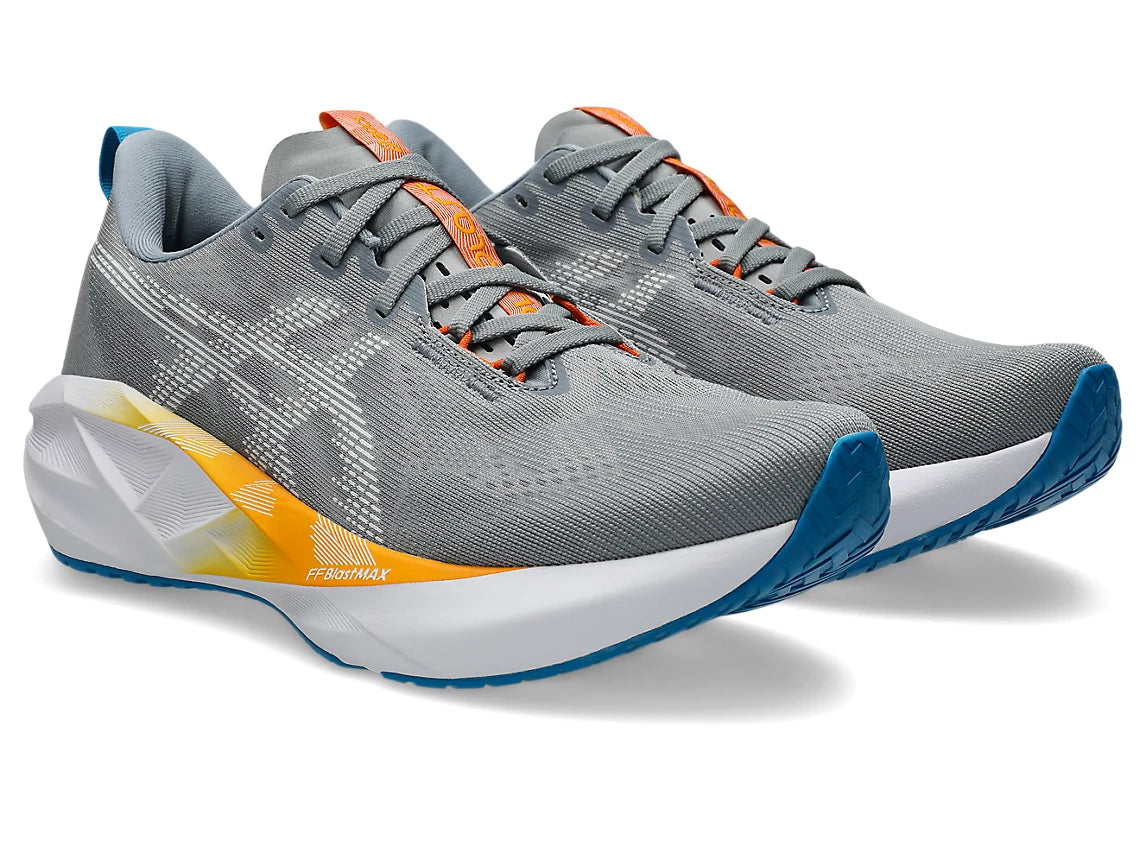 Gray running shoes with orange accents on a white background