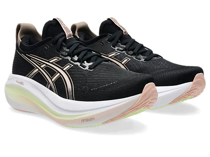 Angled side view of Women's Black Asics Nimbus 27 with white midsoles, pink and yellow detailing