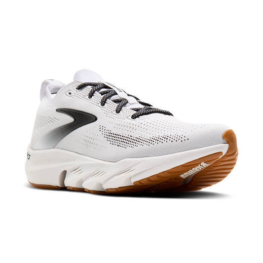 White running shoe with brown sole on a white background