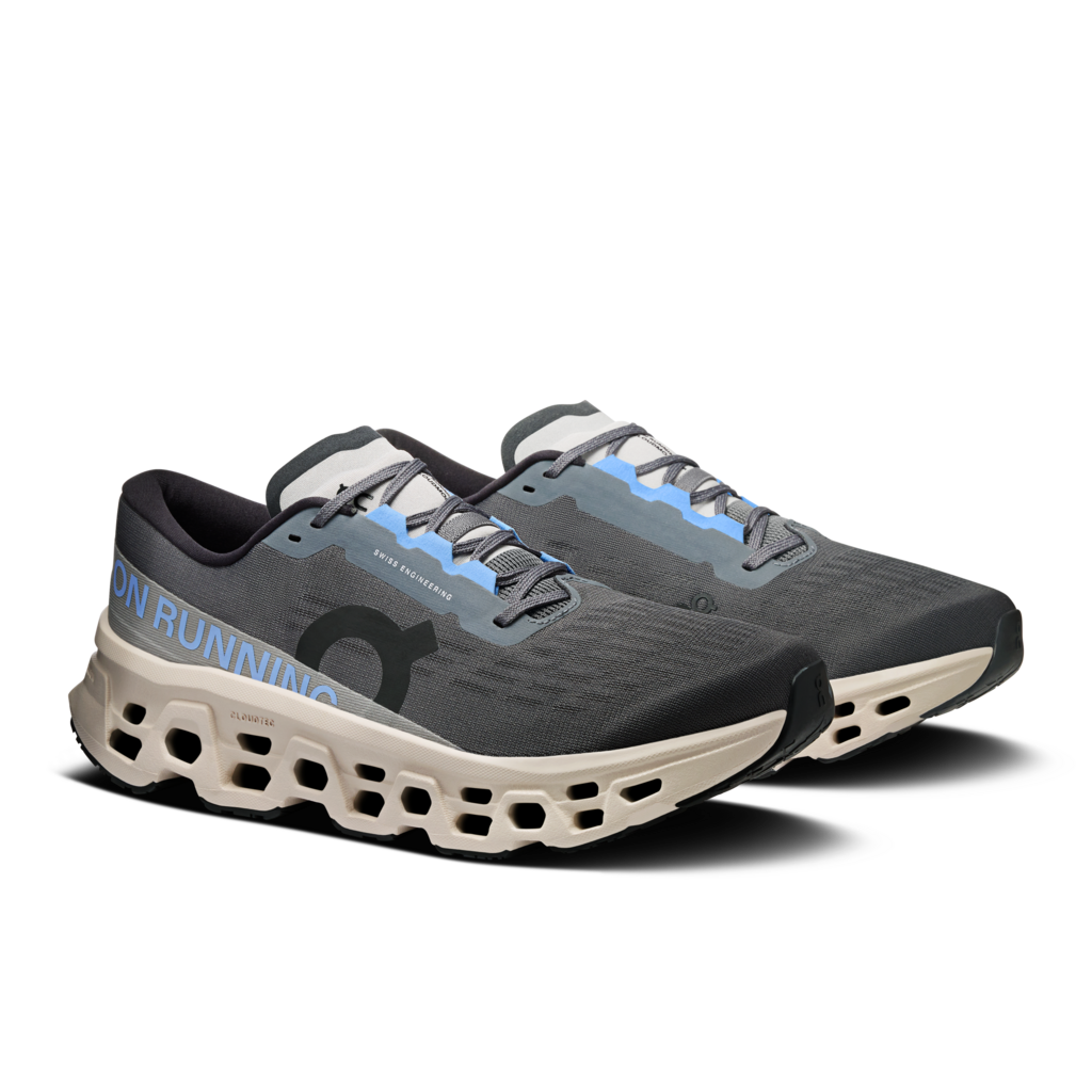 Gray running shoes with blue accents on a white background