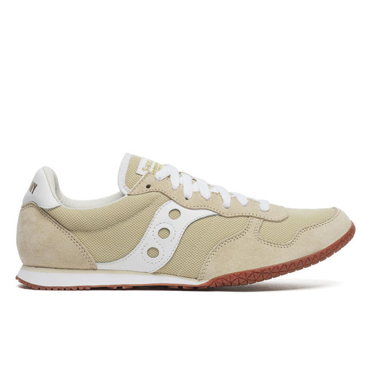 Beige sneaker with white laces and sole on a white background