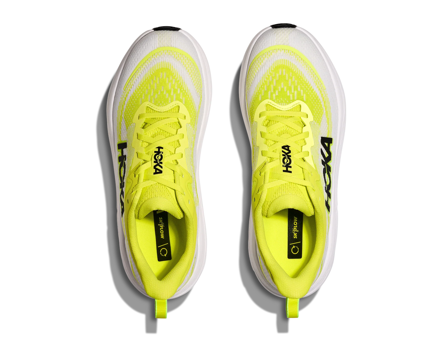 Overhead view of running shoes with neon yellow upper and white sole
