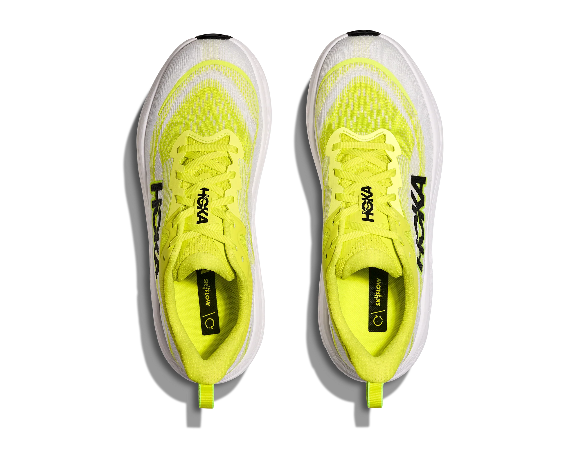Overhead view of running shoes with neon yellow upper and white sole