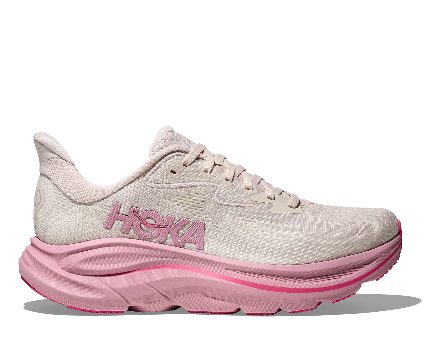Lateral side view of women's white Hoka Clifton 10 with bubble gum pink sole and accents