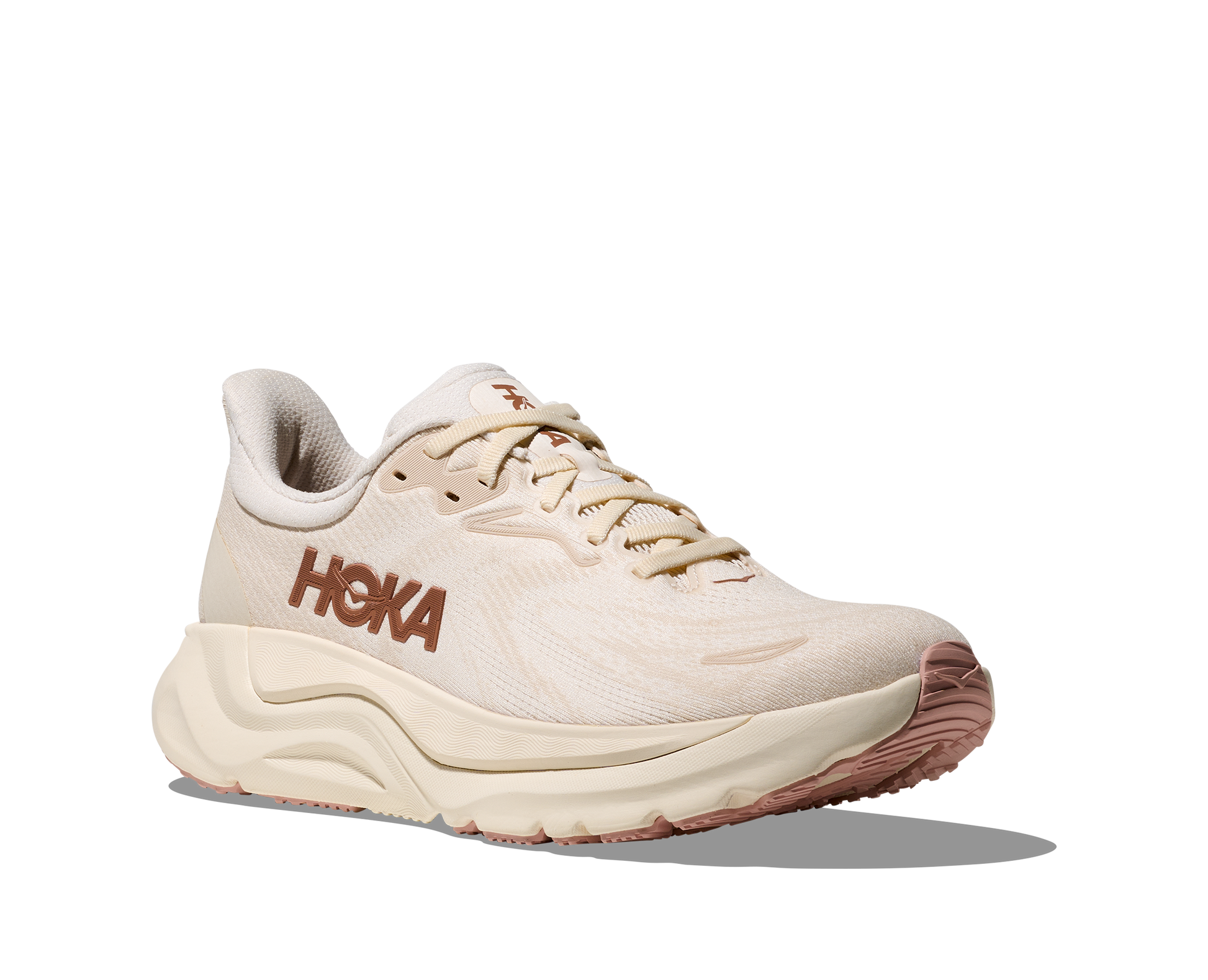 Beige running shoe with 'Hoka' branding on a white background