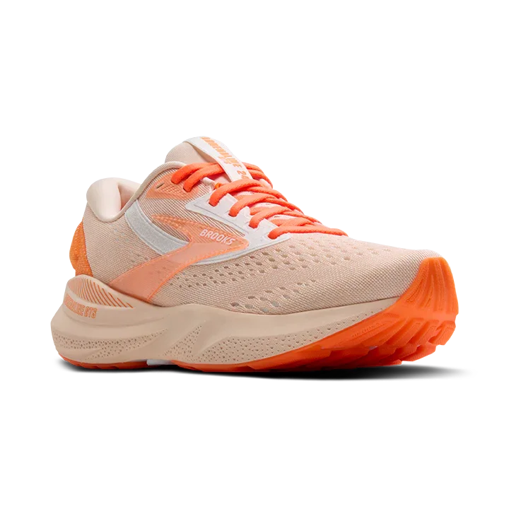 Diagonal angle of running shoes in orange colorway