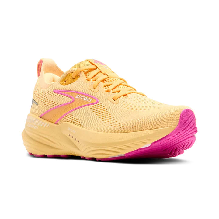 Angled view of Yellow Brooks GTS 22 running shoe with pink sole