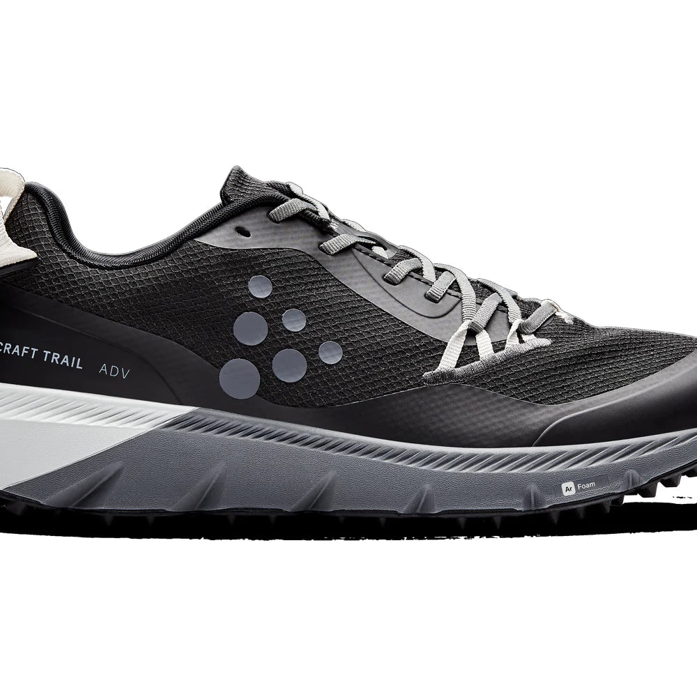 Black and gray Craft trail running shoe on a white background