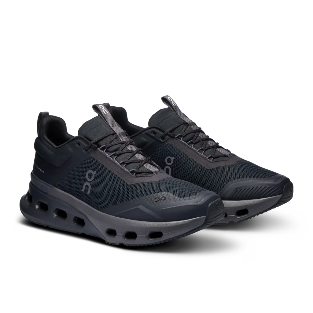 Angled side view of a pair of Women's Black On Cloudnova X training shoes