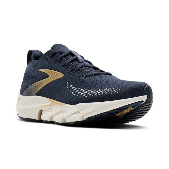 Navy running shoe with white sole on a white background