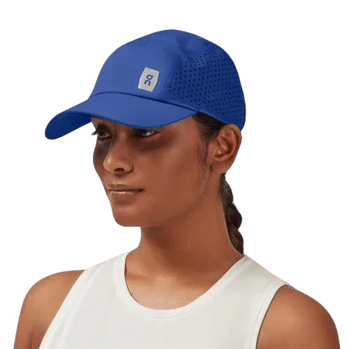 Model wearing blue running cap