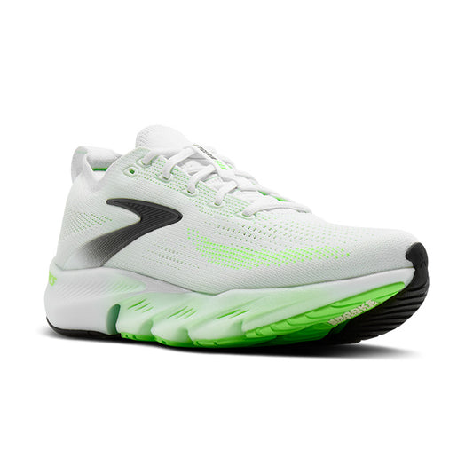 White running shoe with green sole on a white background