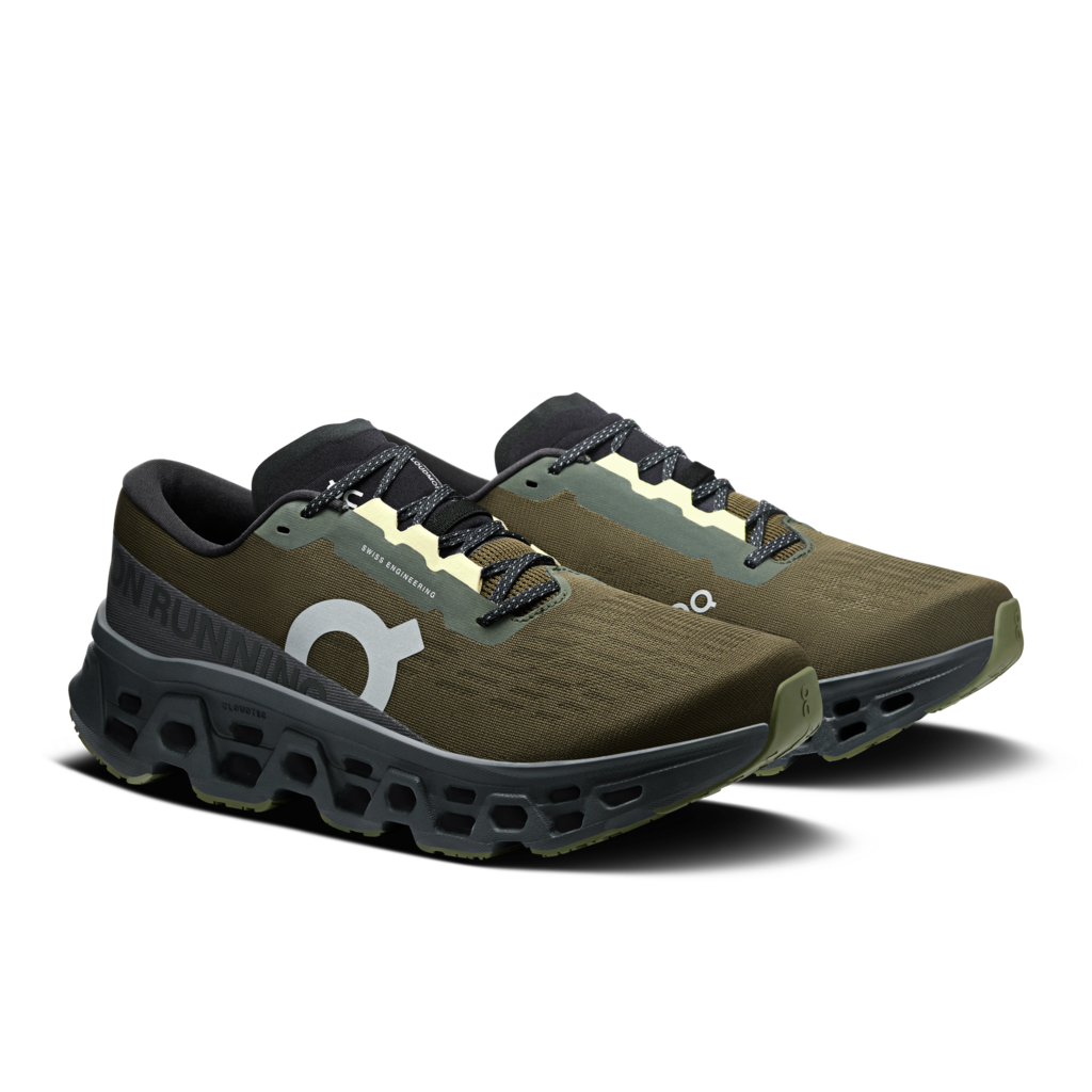 Pair of green running shoes with a white logo on a white background