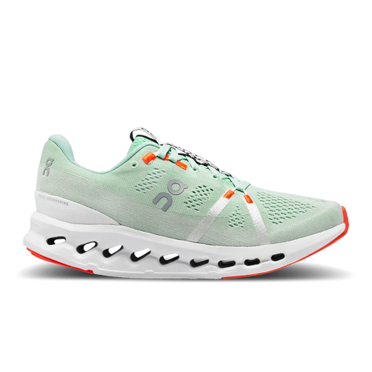 Lateral side view of Women's mint green On Cloudsurfer with silver logo and orange detailing