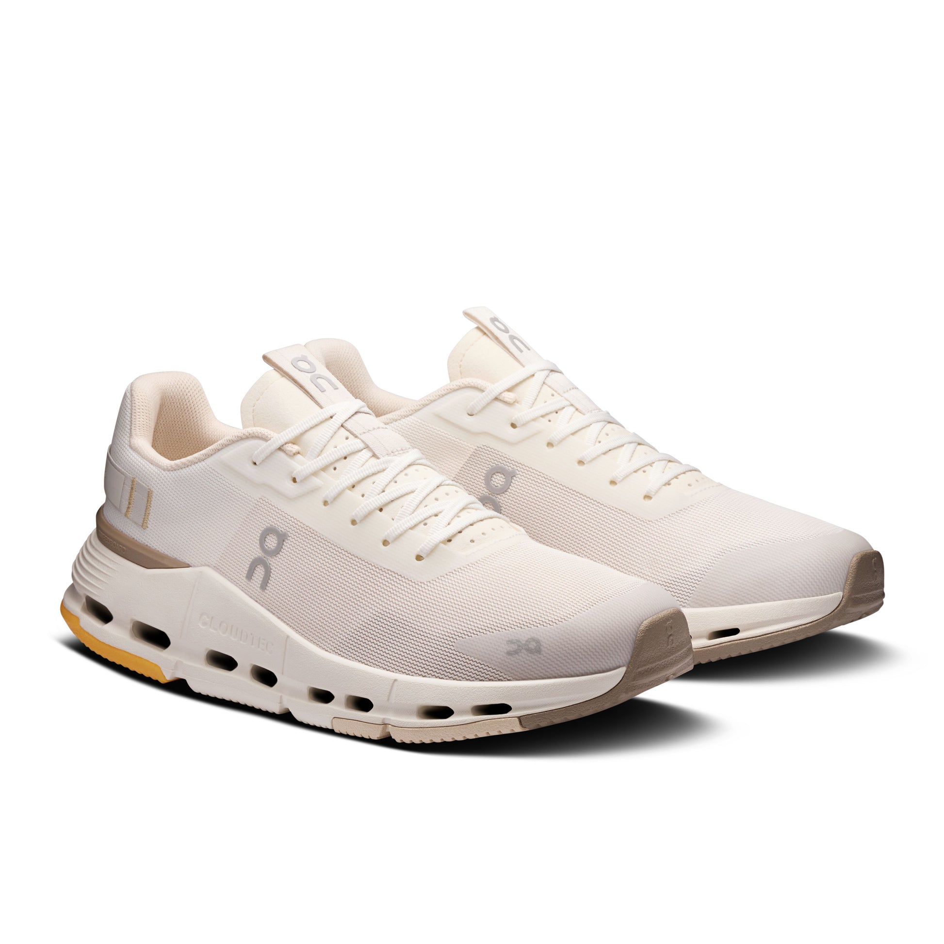 Angled lateral side view of a pair of Women's white and beige On Cloundnova Form 2 sneakers