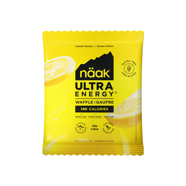 Yellow package of Naak Ultra Energy Waffle with lemon slices on a transparent background